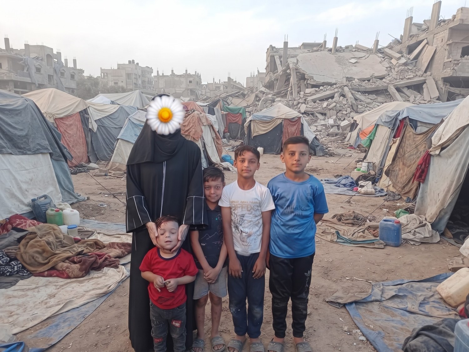 Um Mohammed with her four children in Gaza